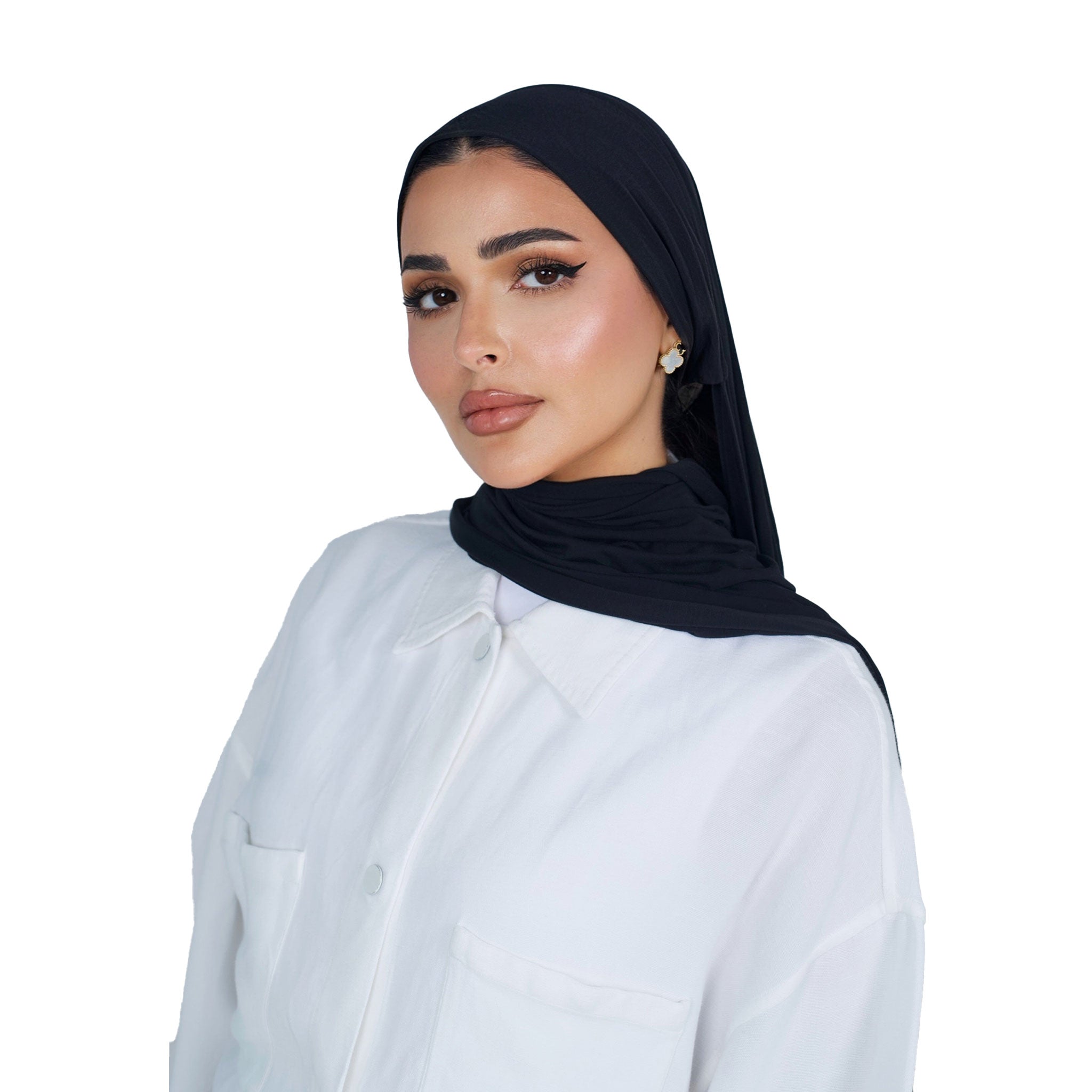 Woman wearing a black hijab and white shirt on a white background